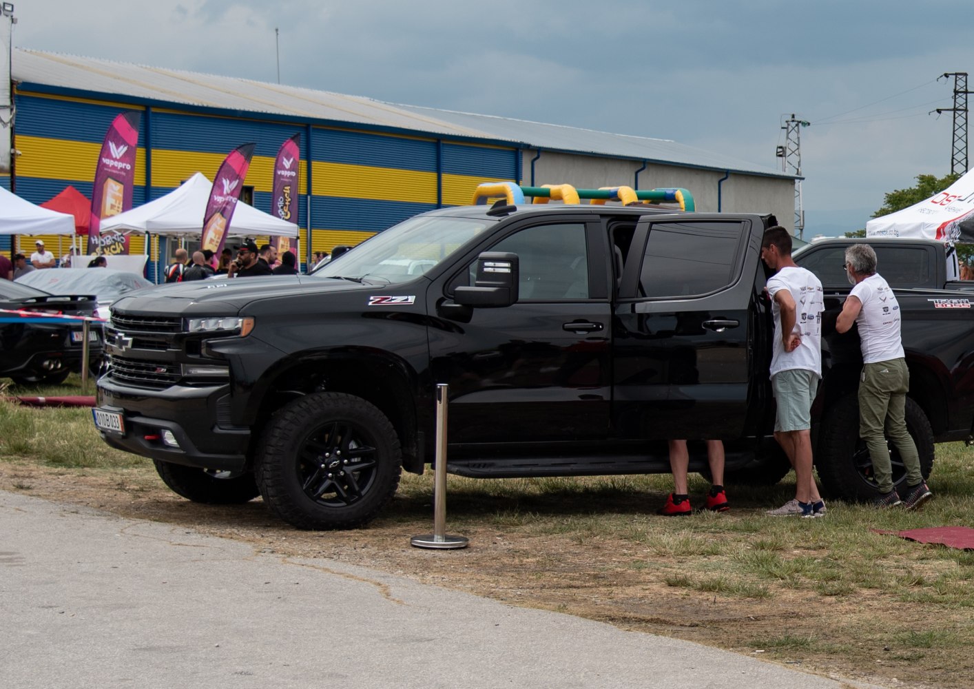 Black pickup truck with crew cab and off-road tires