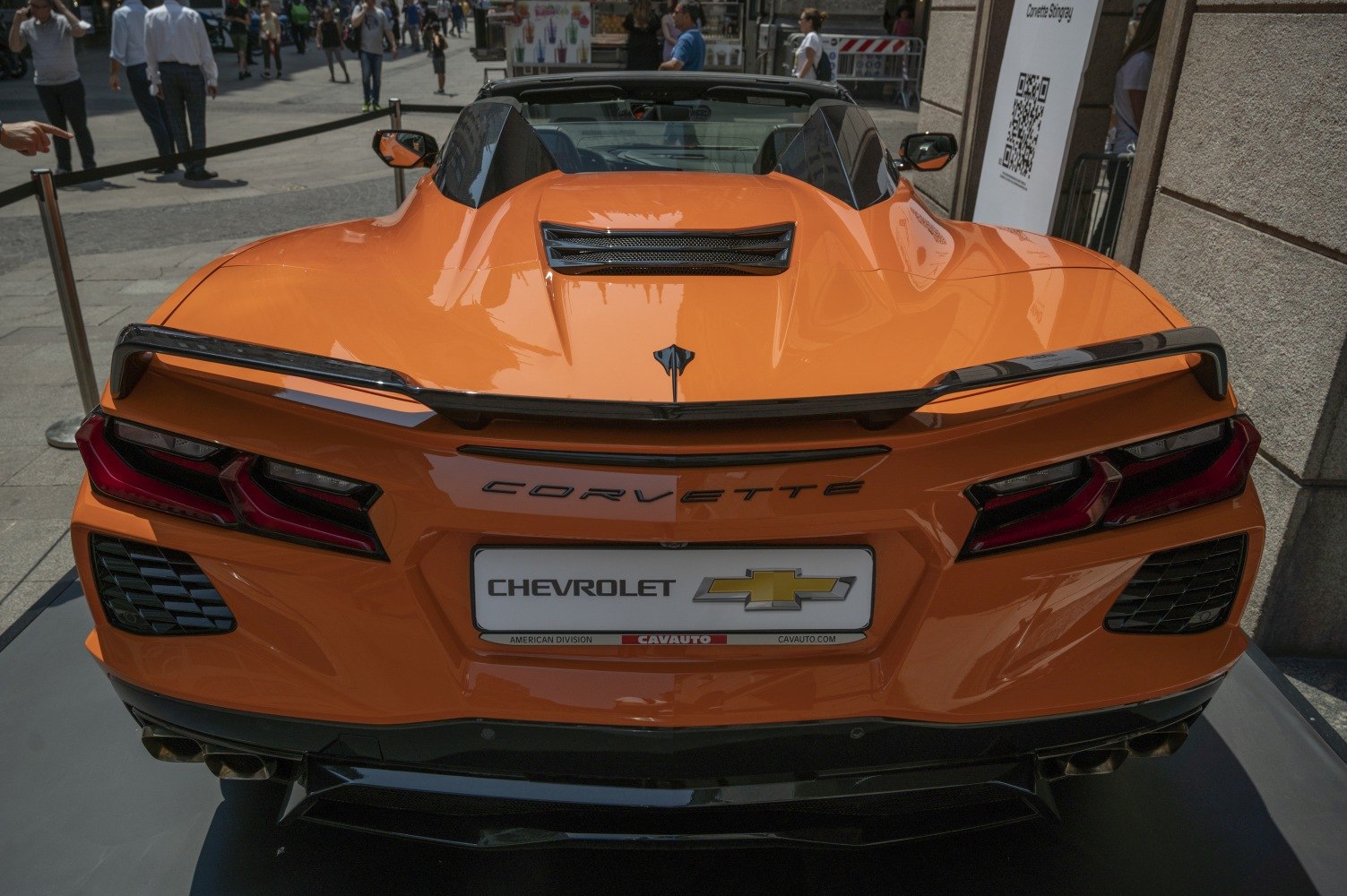 Rear view with distinctive taillights and aerodynamic rear wing