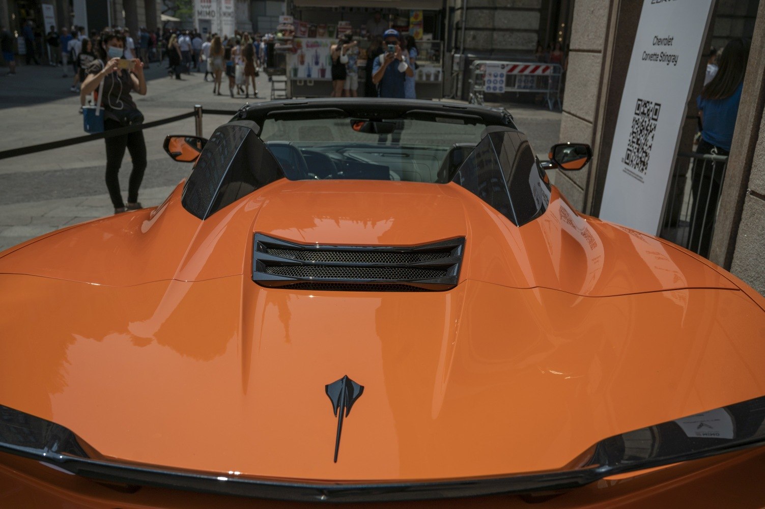 Rear engine cover vent and aerodynamic lines on orange convertible
