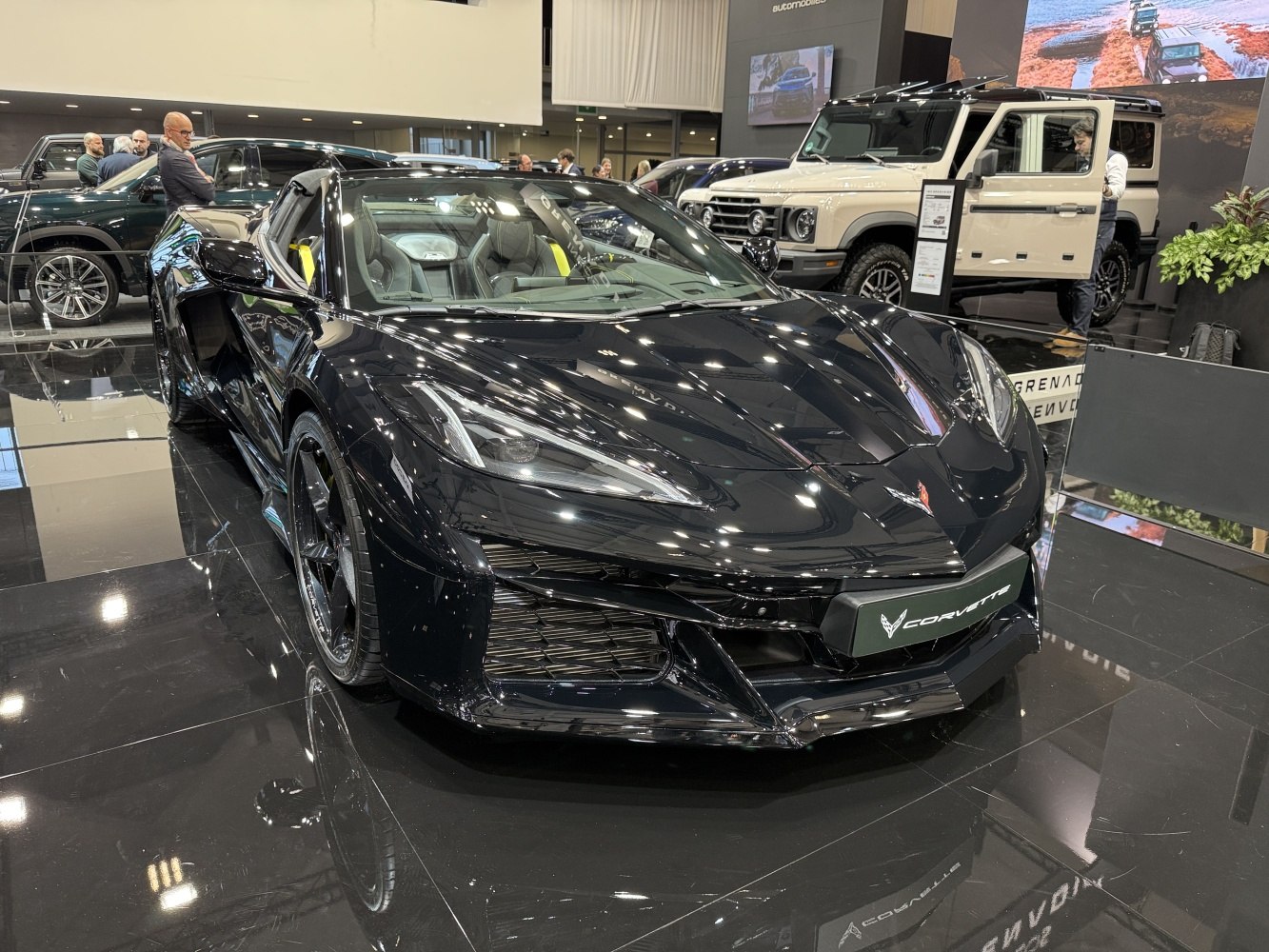 Sleek black Corvette Convertible C8 front and side view, glossy finish