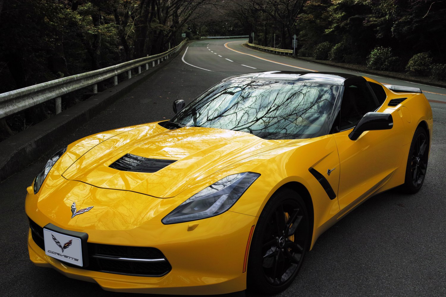 Yellow sports car front-side view with sharp headlights and aerodynamic curves