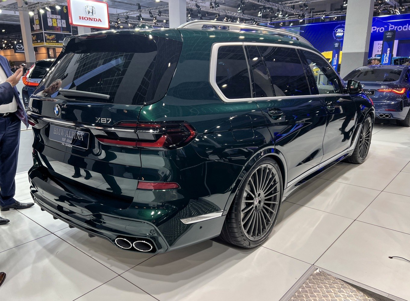 Rear view with quad exhaust and large multi-spoke alloy wheels