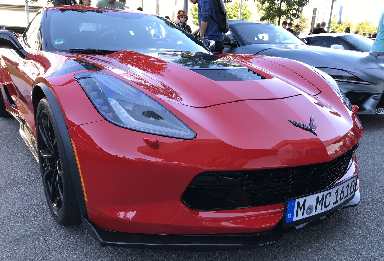 Front view with sleek headlights and aggressive grille