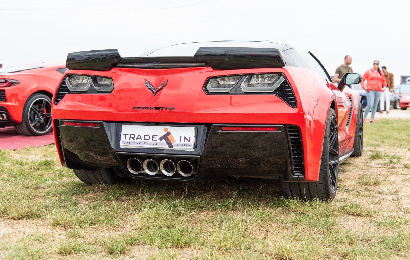 Rear view with quad exhaust pipes and angular taillights