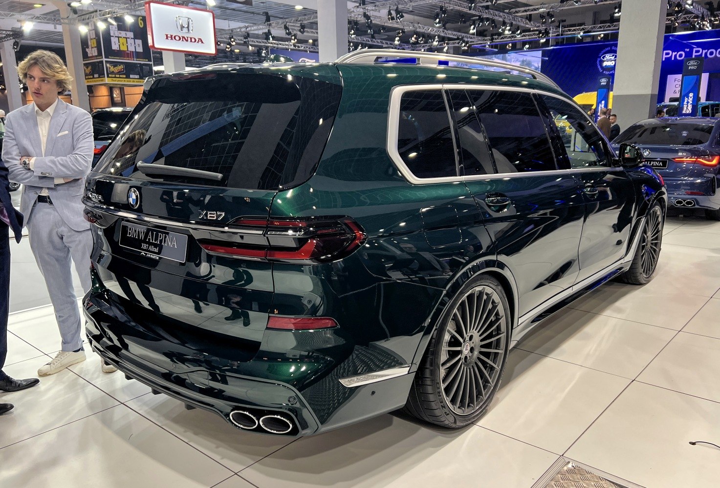 Rear and exhaust of luxury SUV with quad tips and tinted windows