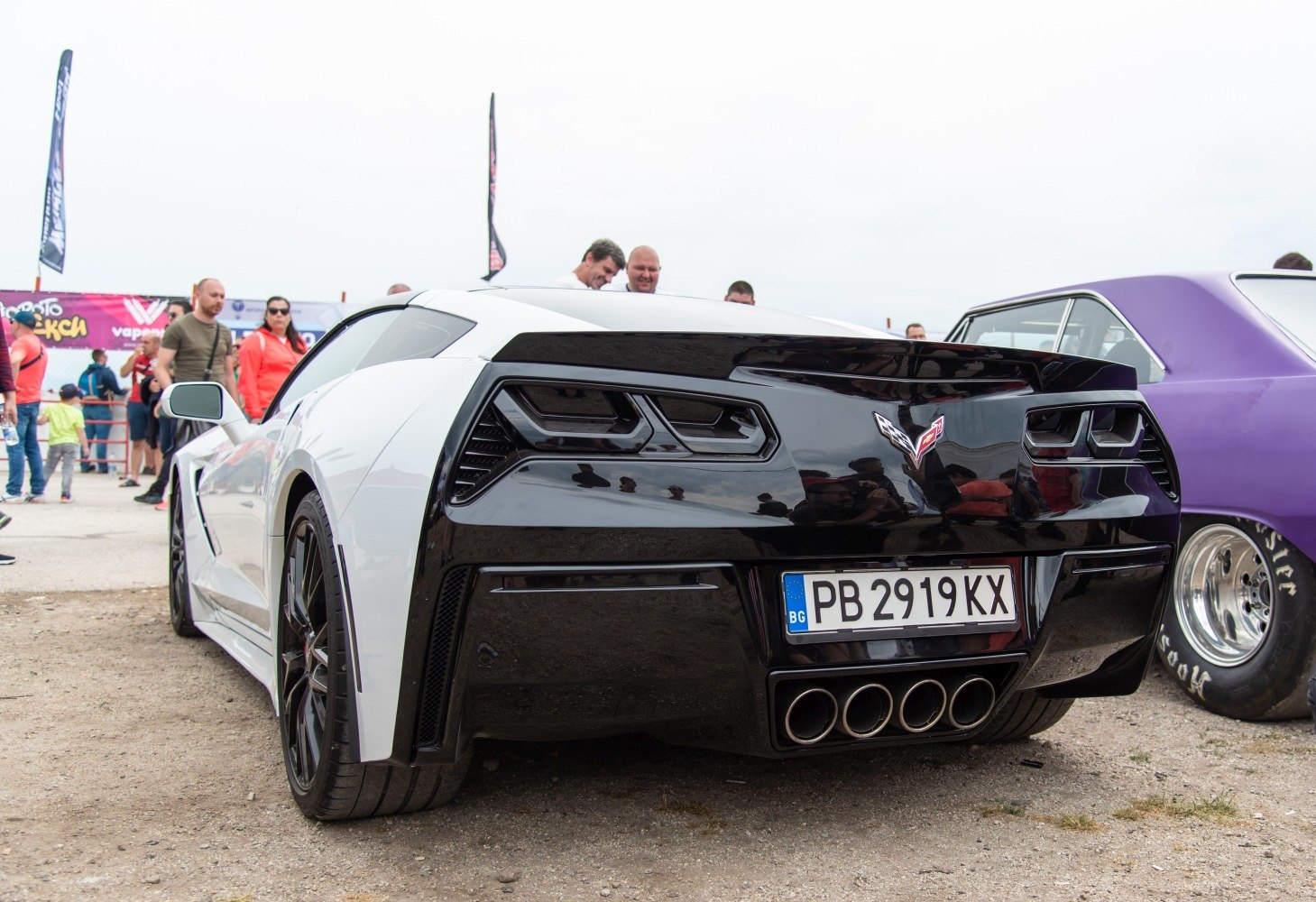Black and white rear with quad exhaust and distinctive taillights