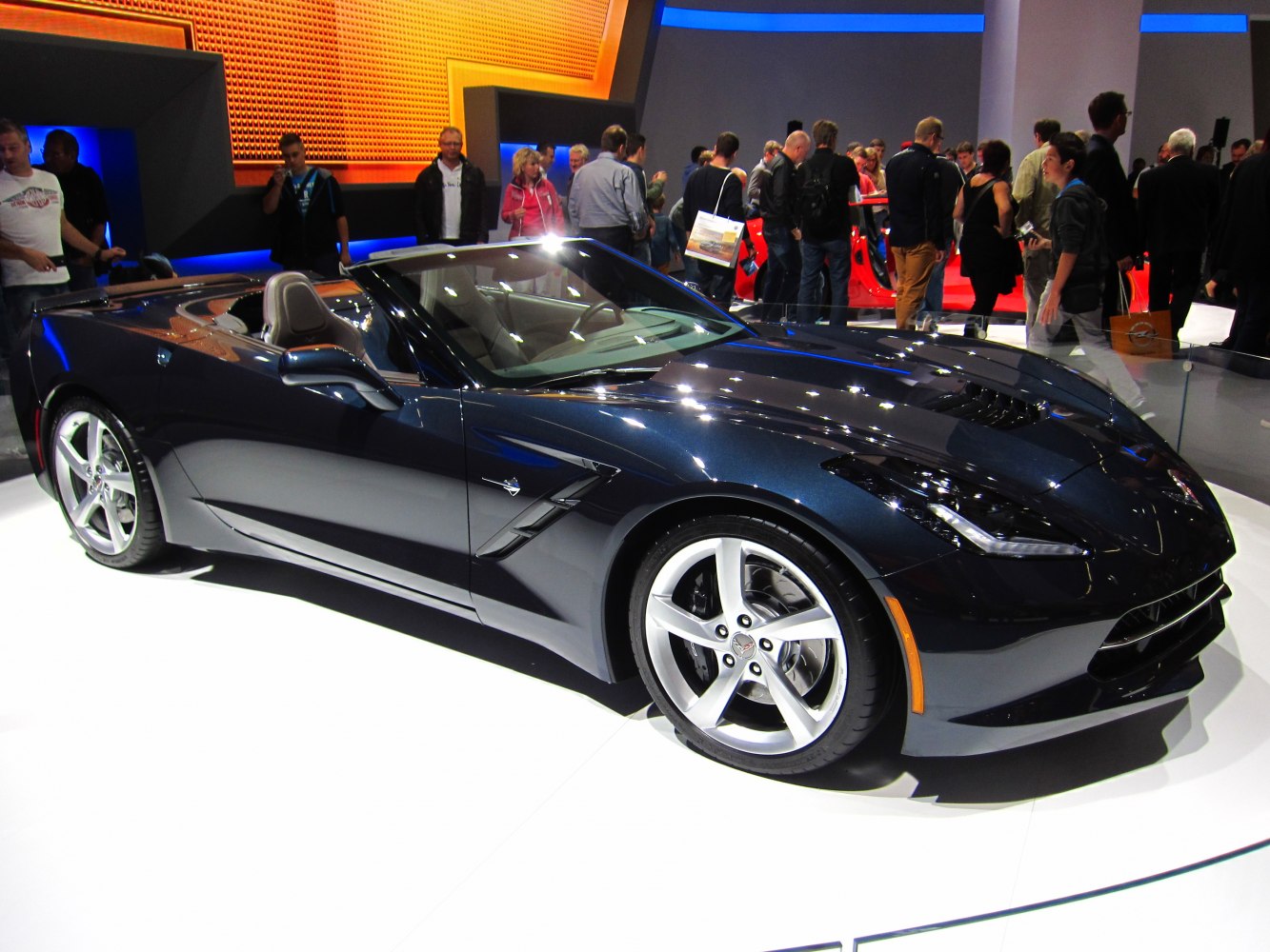 Front-side view of sleek convertible with alloy wheels