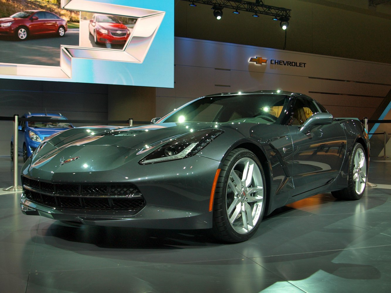 Sleek sports coupe front with sharp headlights and alloy wheels