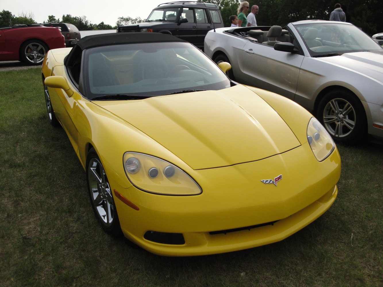 Yellow convertible sports car with sleek headlights and aerodynamic design