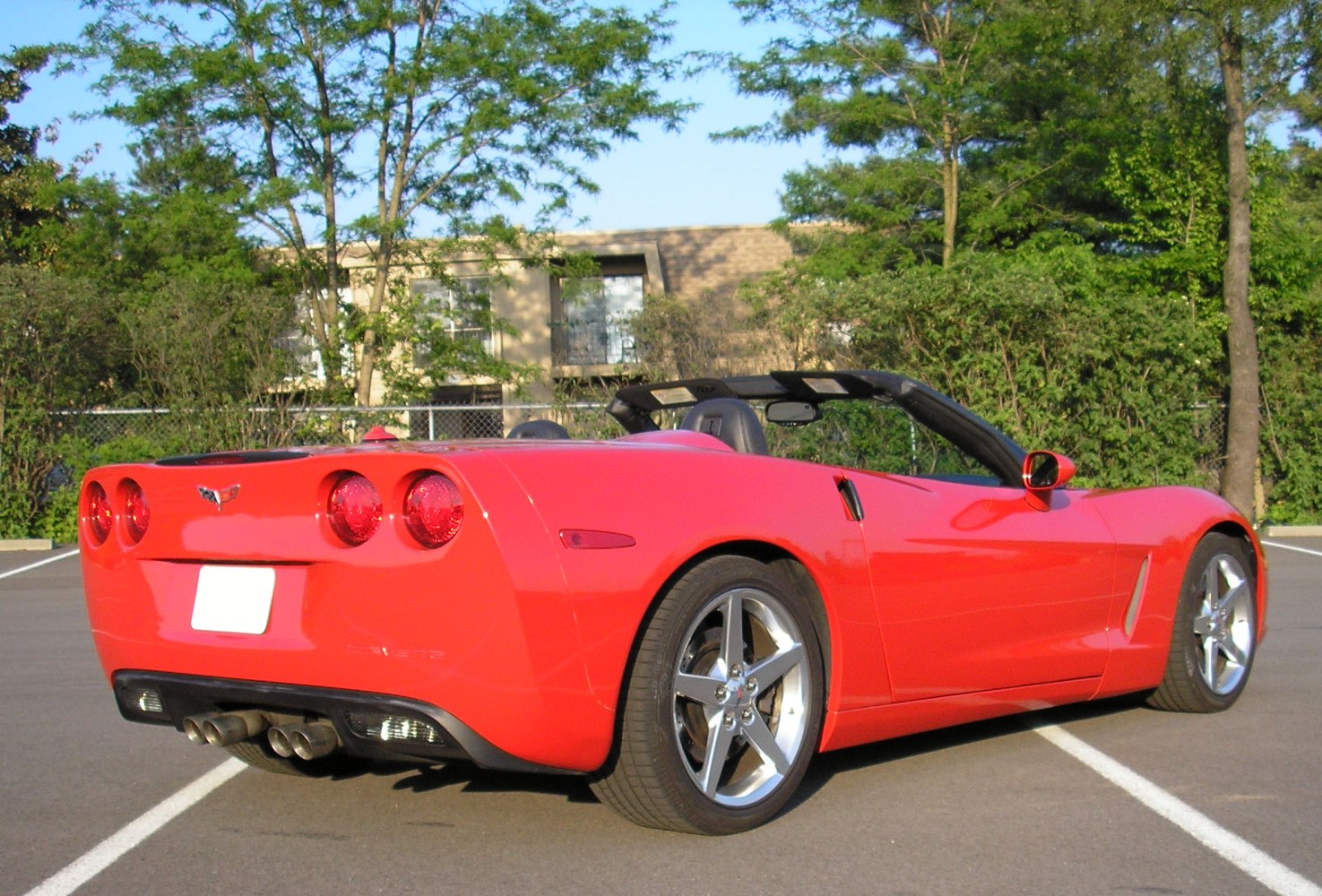 Red convertible with quad exhaust and alloy wheels