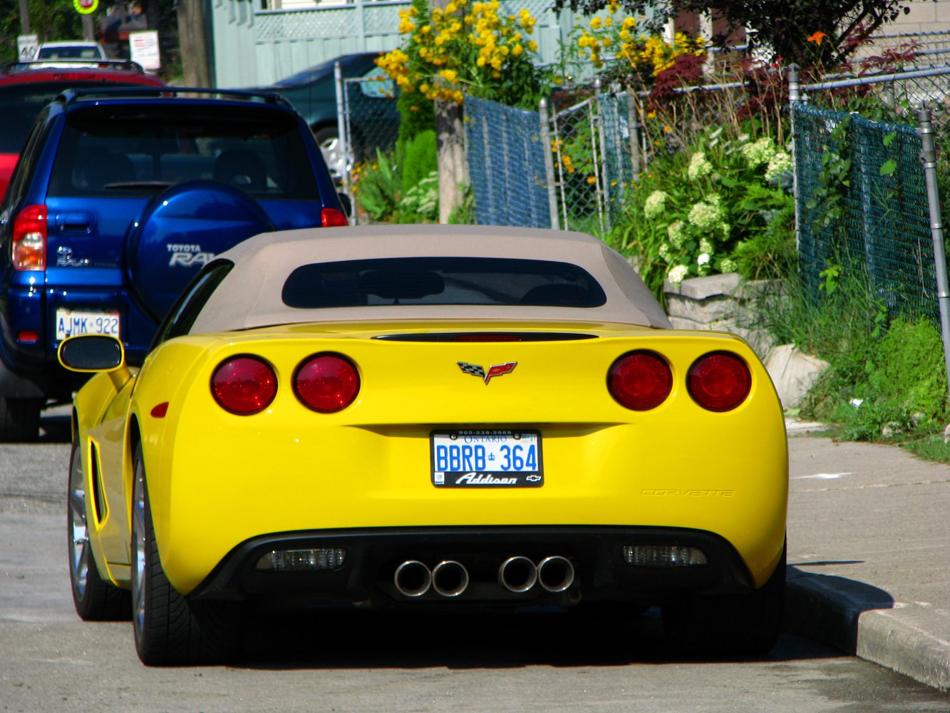 Yellow convertible rear with quad exhaust and round tail lights