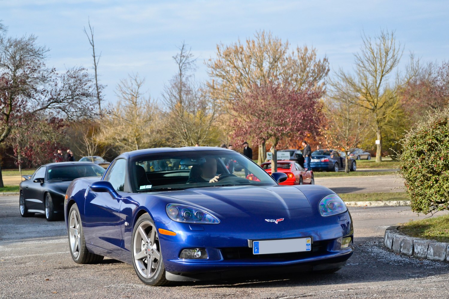 Front three-quarter view with sleek headlights and alloy wheels