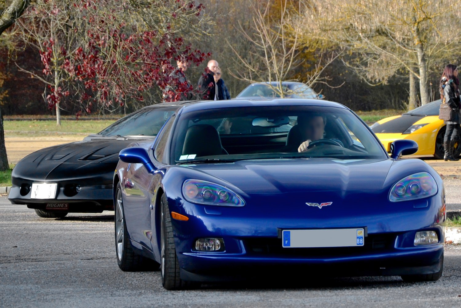 Front view of a sports coupe with distinctive headlight clusters and low, sleek front fascia.
