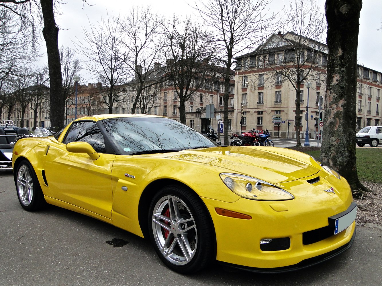 Yellow sports coupe with aerodynamic body and alloy wheels