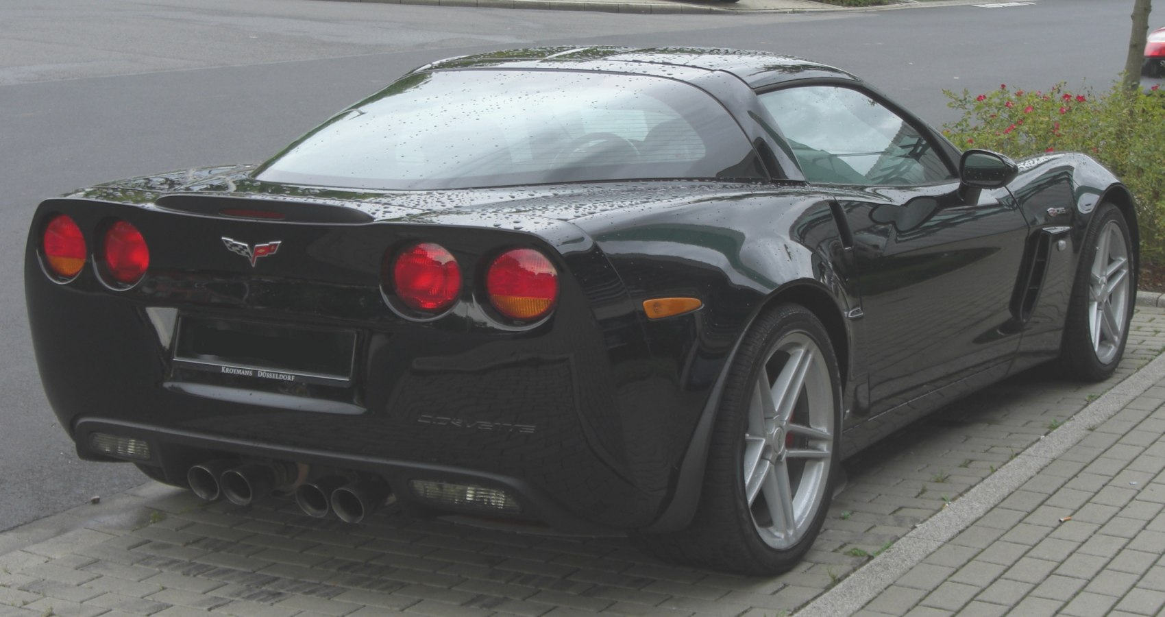 Rear view with round tail lights and quad exhaust tips