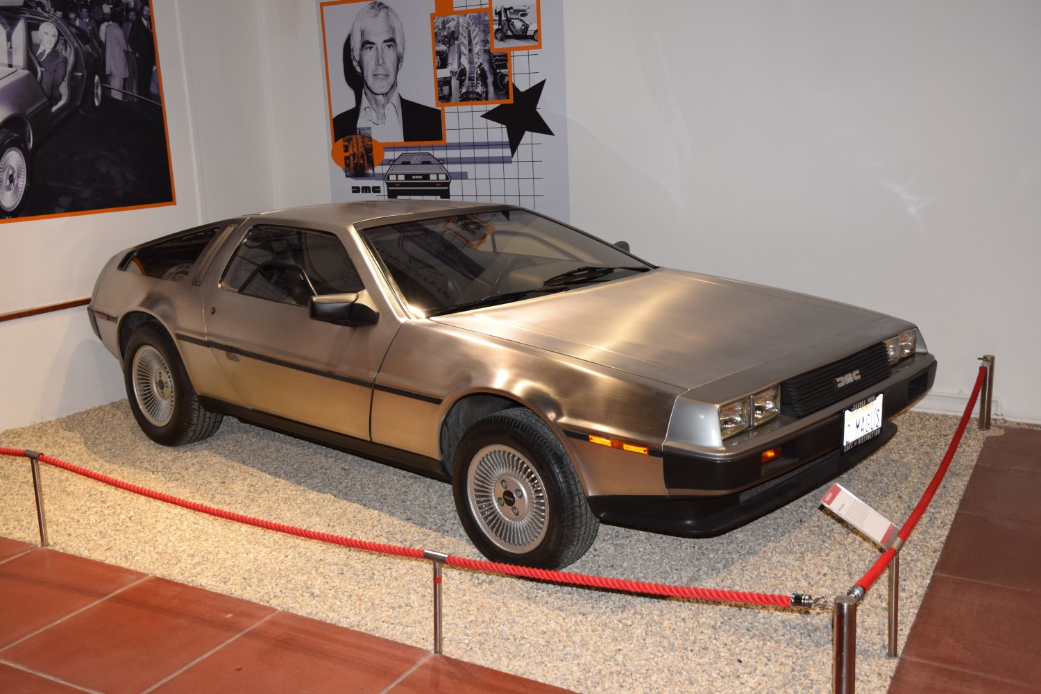 Stainless steel body with gull-wing doors and alloy wheels