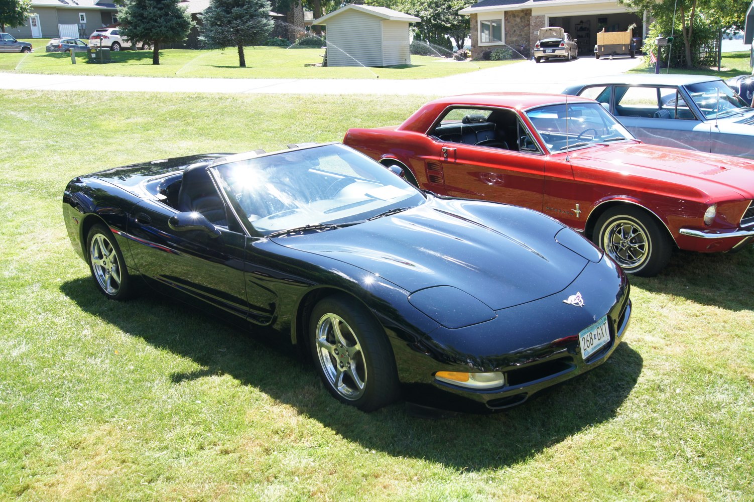 Black convertible with sleek aerodynamic design and pop-up headlights
