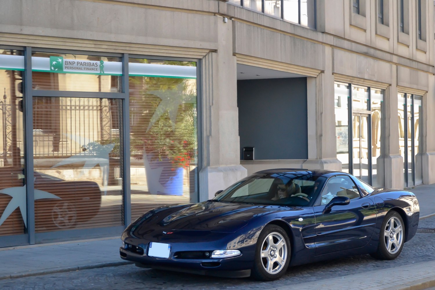 Front-side view of sleek Chevrolet Corvette C5 coupe with aerodynamic design.
