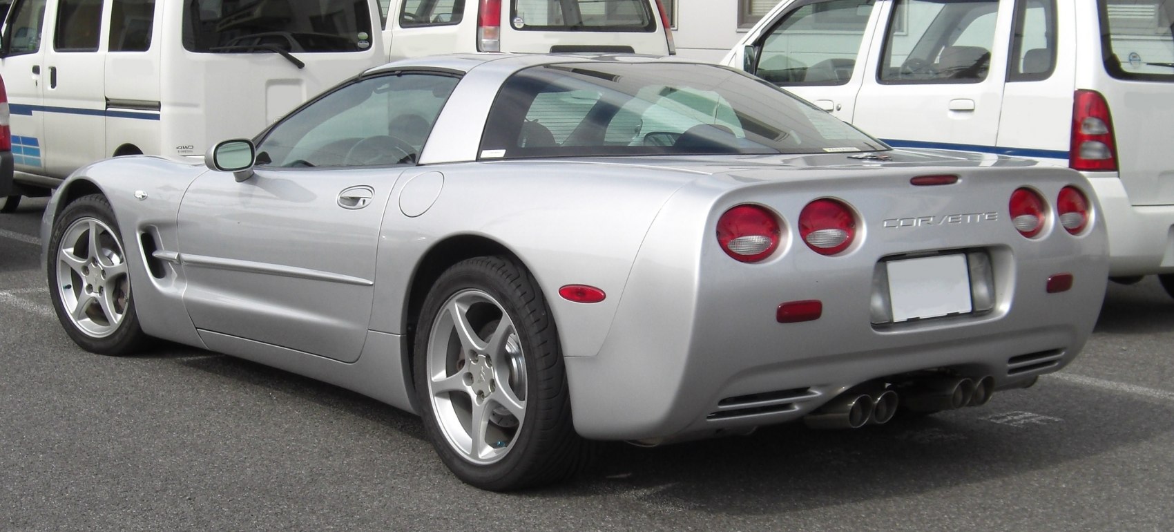 Rear view with quad circular taillights and silver sleek design