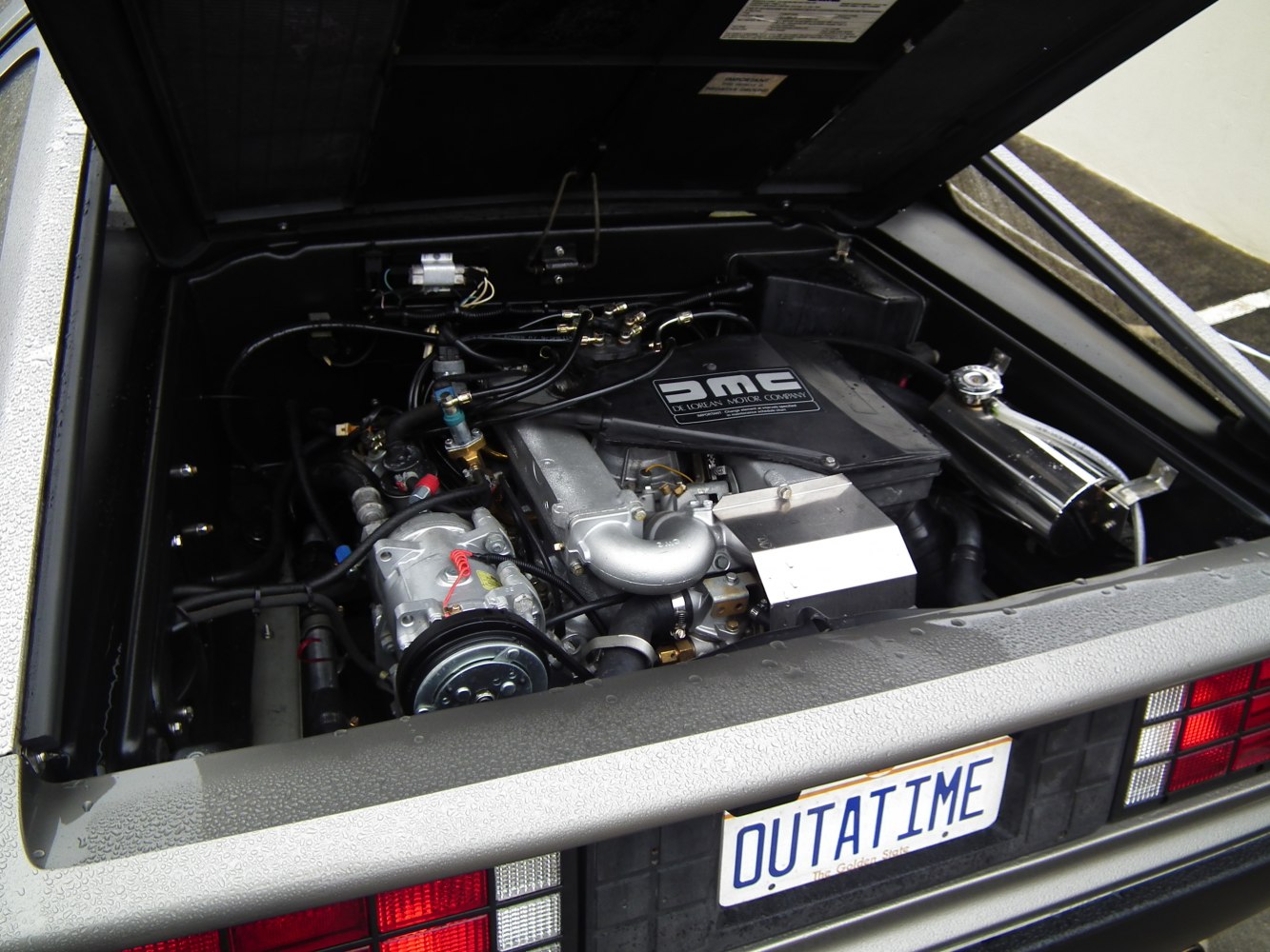 Open engine bay showing detailed mechanical parts and components.