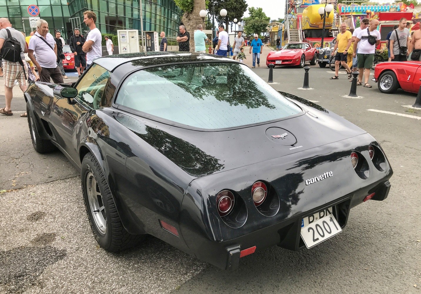 Black coupe with distinctive rear and quad circular taillights