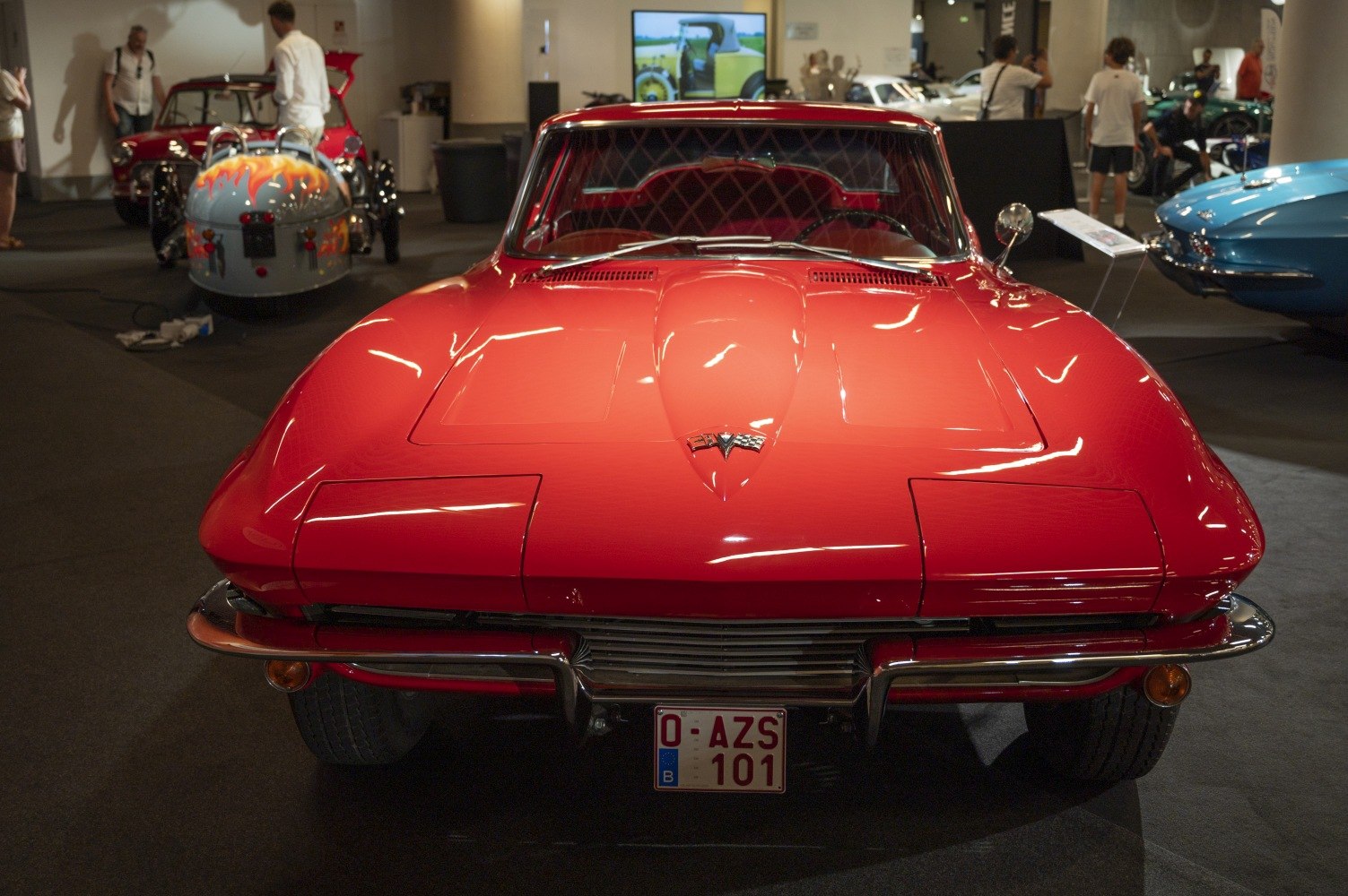 Front view of classic car with iconic hood and pop-up headlights