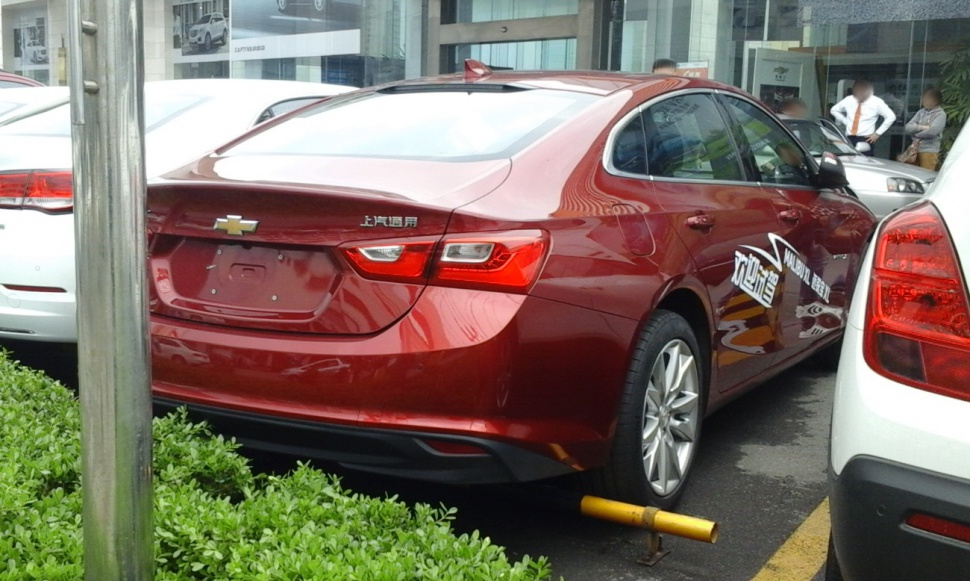 Rear view of sedan with LED tail lights and sleek trunk design