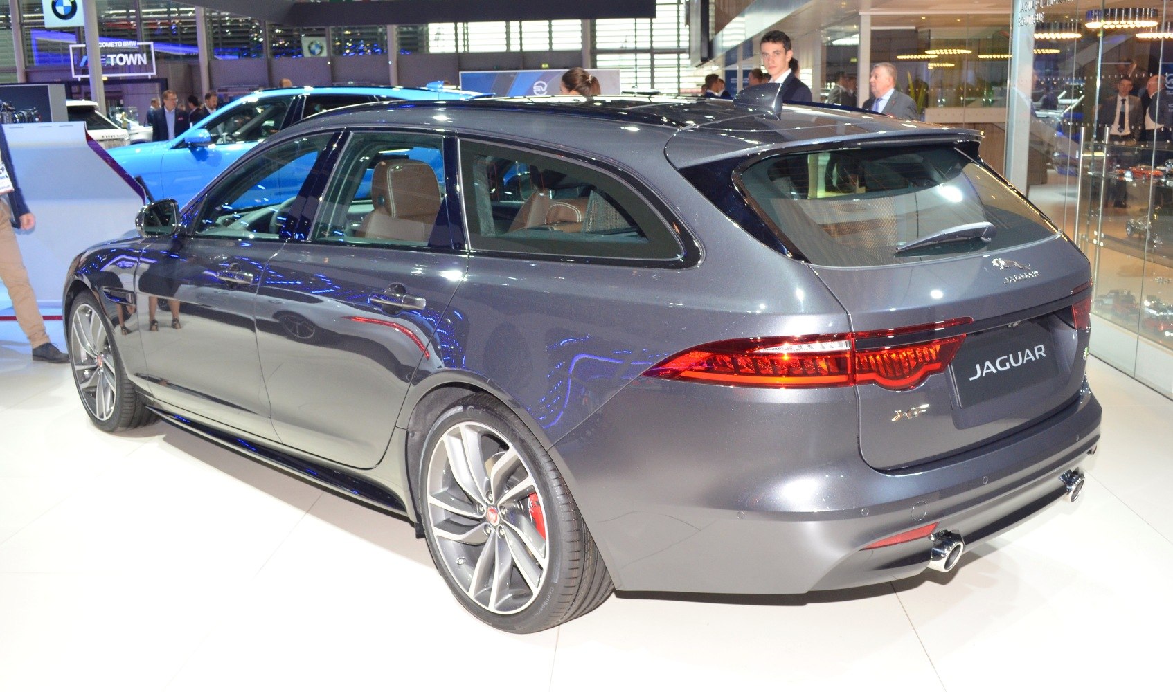 Rear side profile of sporty station wagon with alloy wheels and dual exhausts