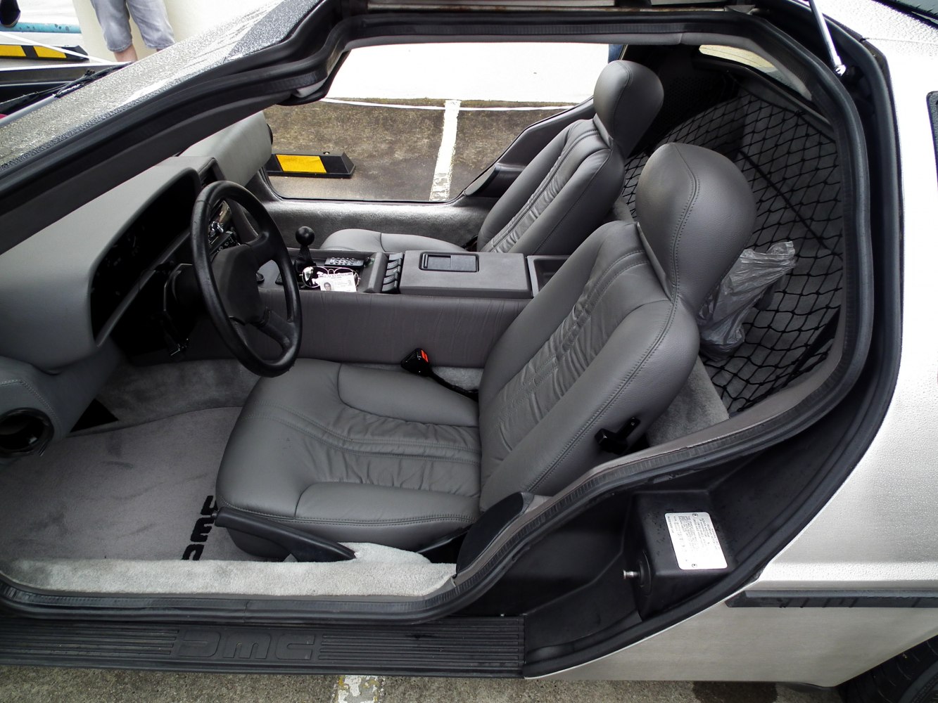 Manual transmission and leather bucket seats in classic sports car interior