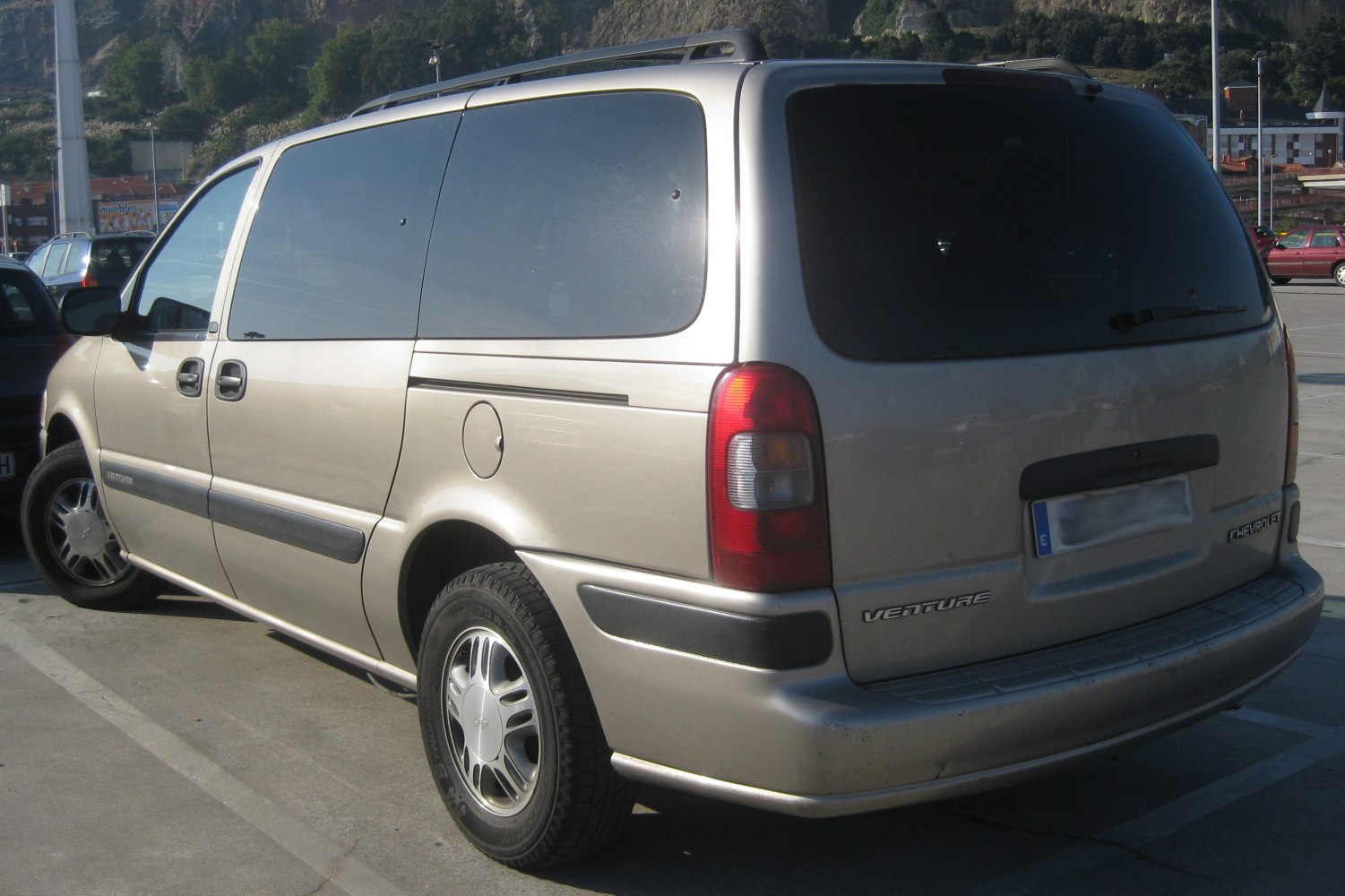 Side and rear view of minivan with sliding door and rear hatch