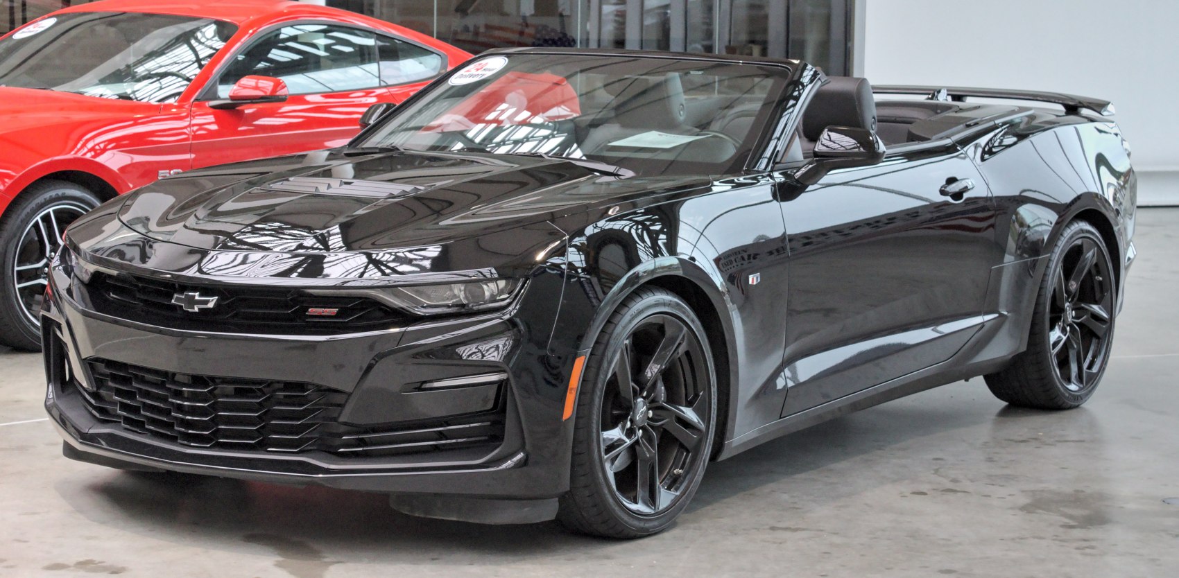 Black convertible with aggressive front grille and alloy wheels