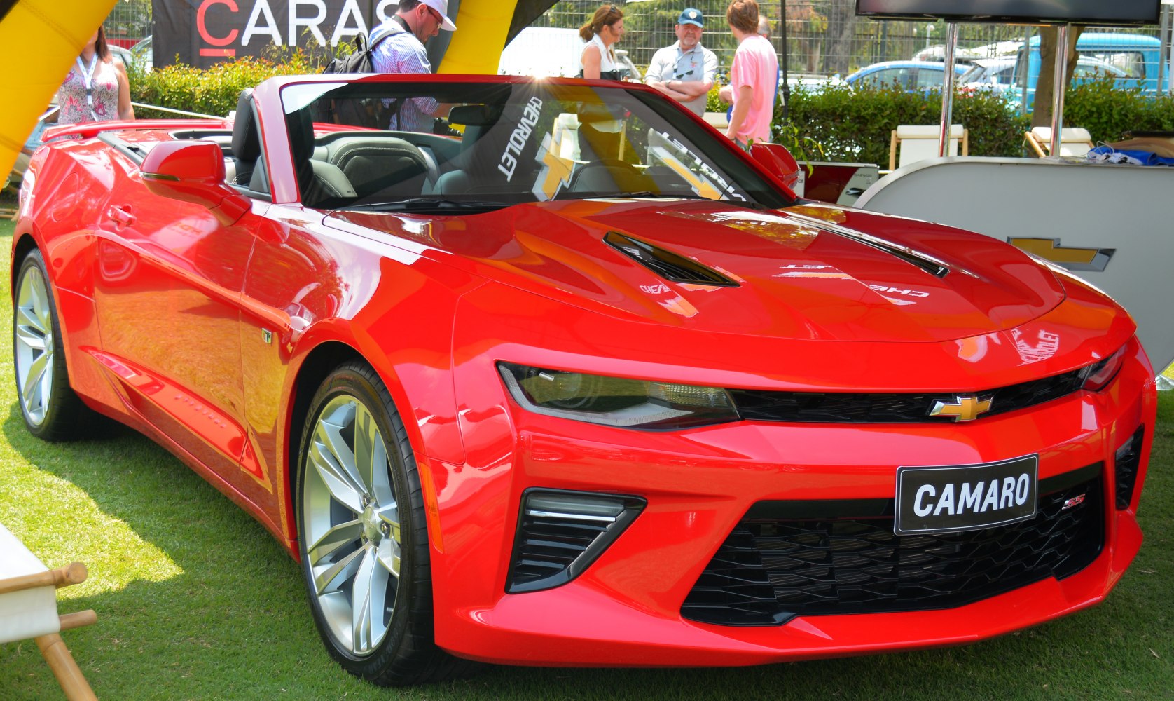 Red convertible with aggressive front fascia and sporty design