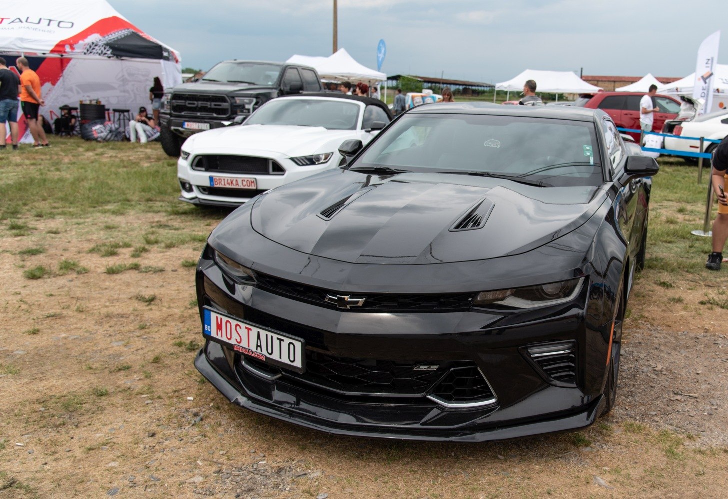Front view with aggressive hood vents and sharp headlights
