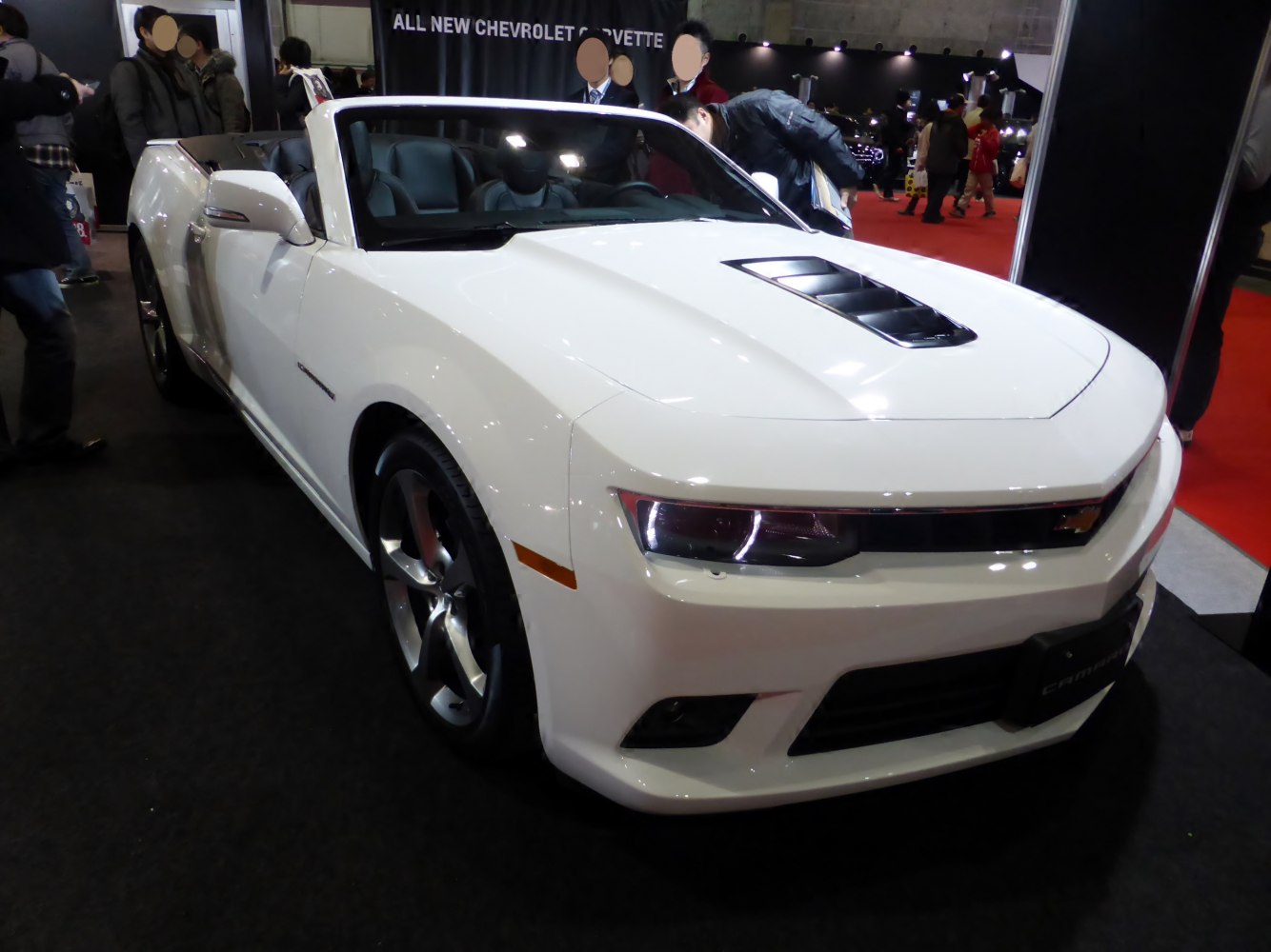 Convertible sports car with vented hood and alloy wheels