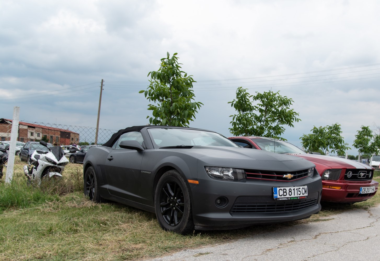 Matte black convertible with sporty front and black wheels