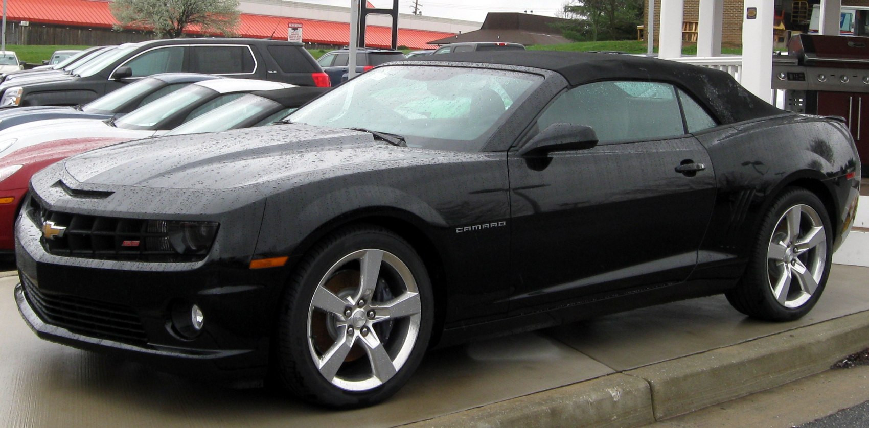 Black soft top convertible with sporty five-spoke alloy wheels