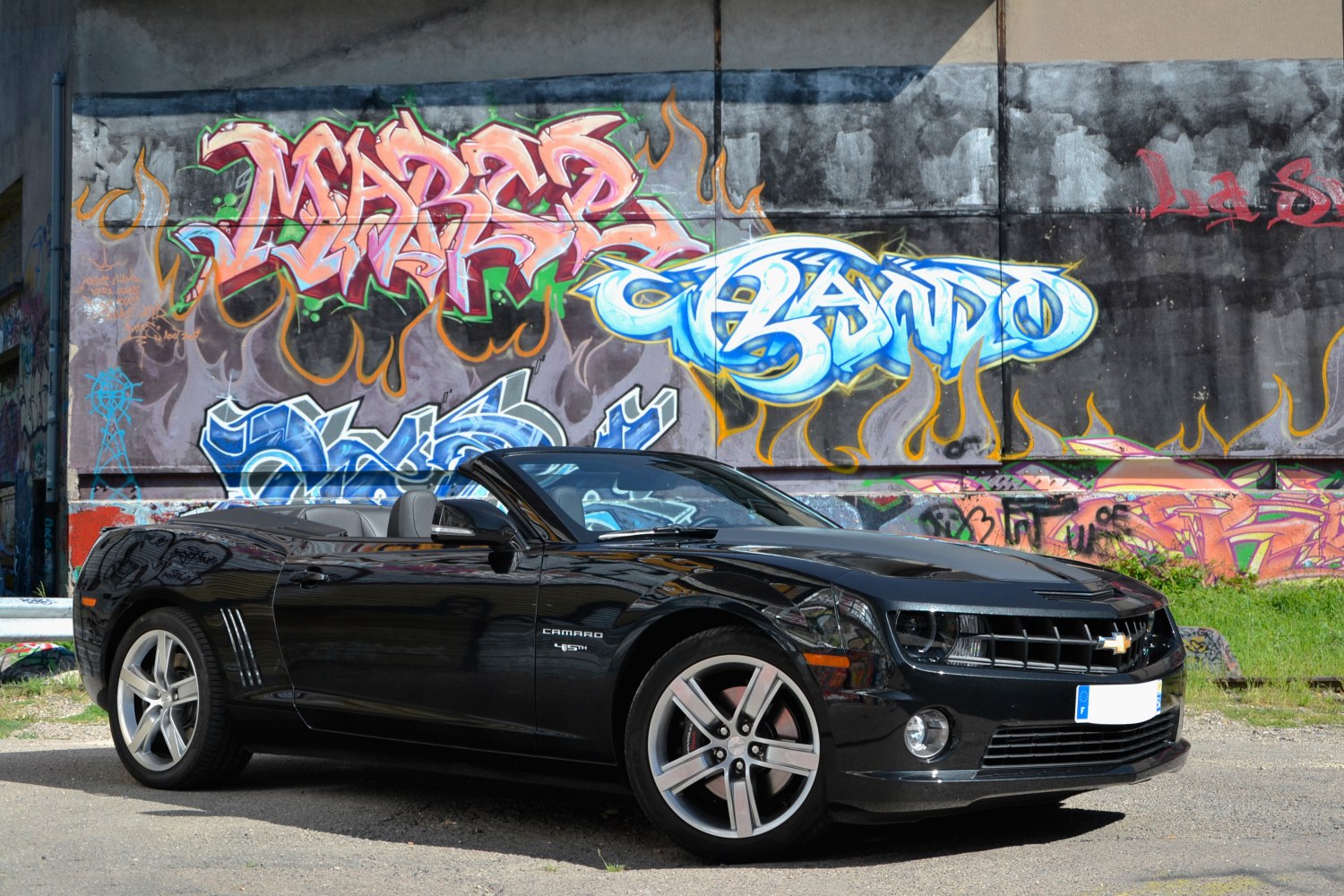 Black convertible with aerodynamic hood and five-spoke alloy wheels