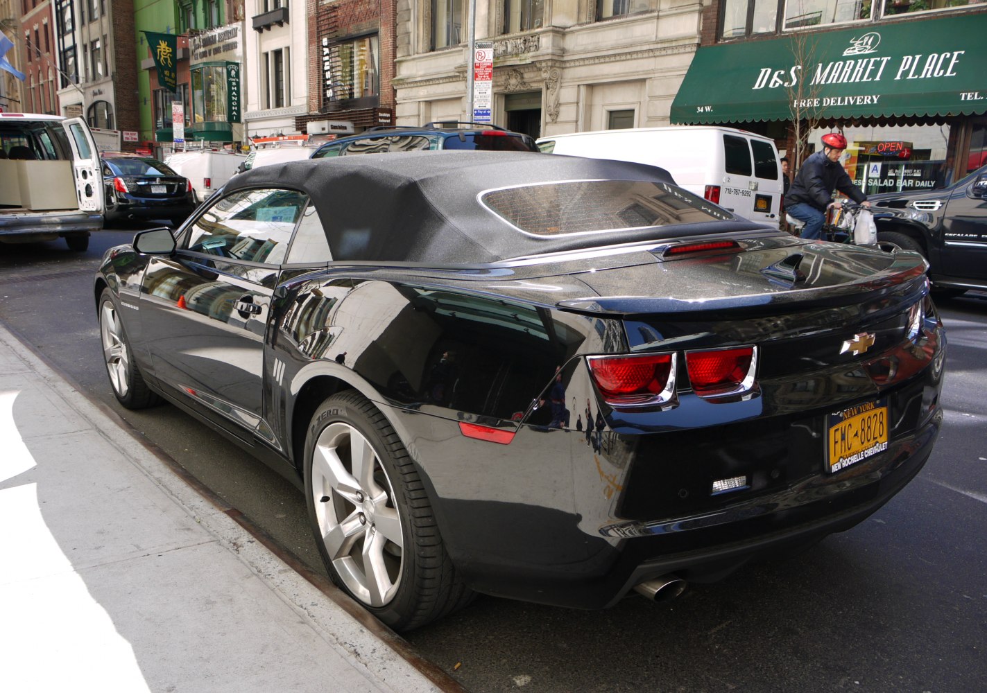 Rear view with soft top roof and dual exhaust