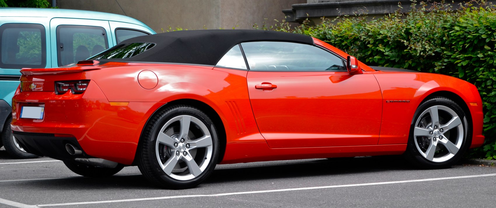 Soft top convertible with silver alloy wheels and red body