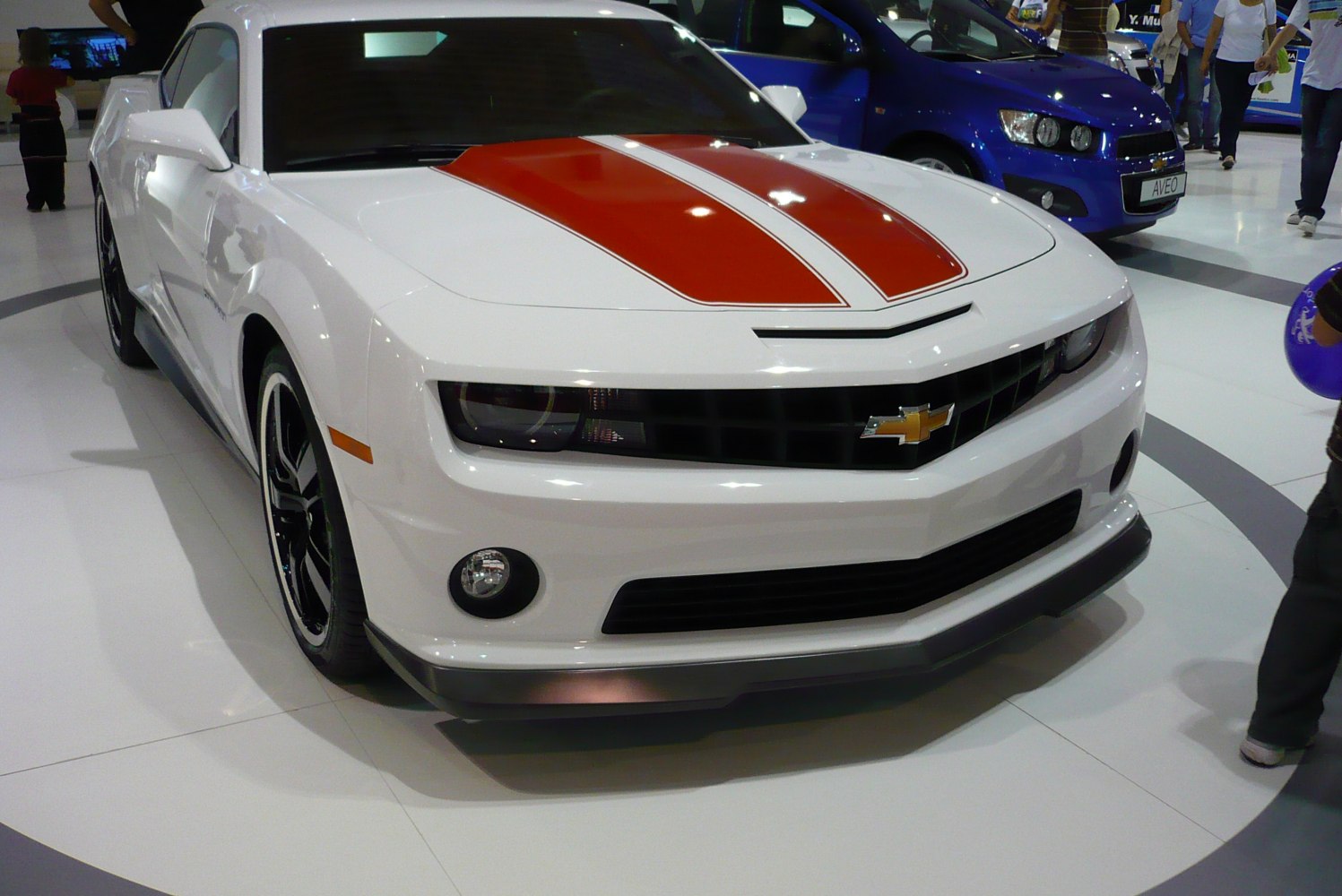 Front view of white car with orange racing stripes