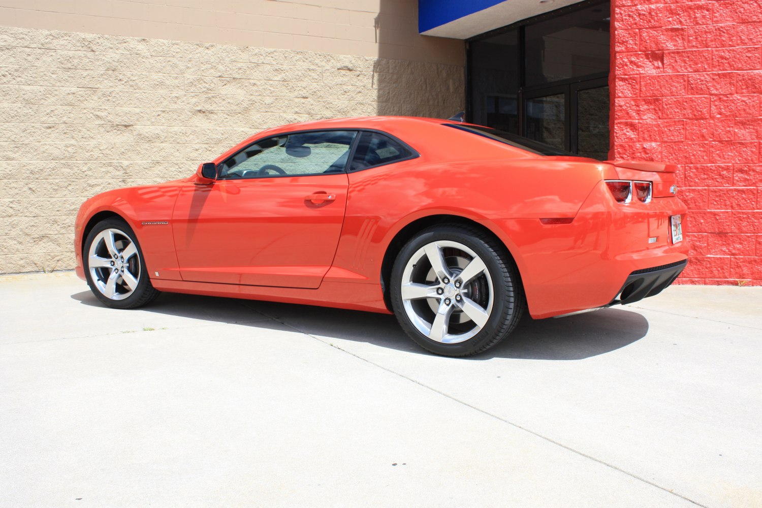 Side profile of sleek muscle car with alloy wheels