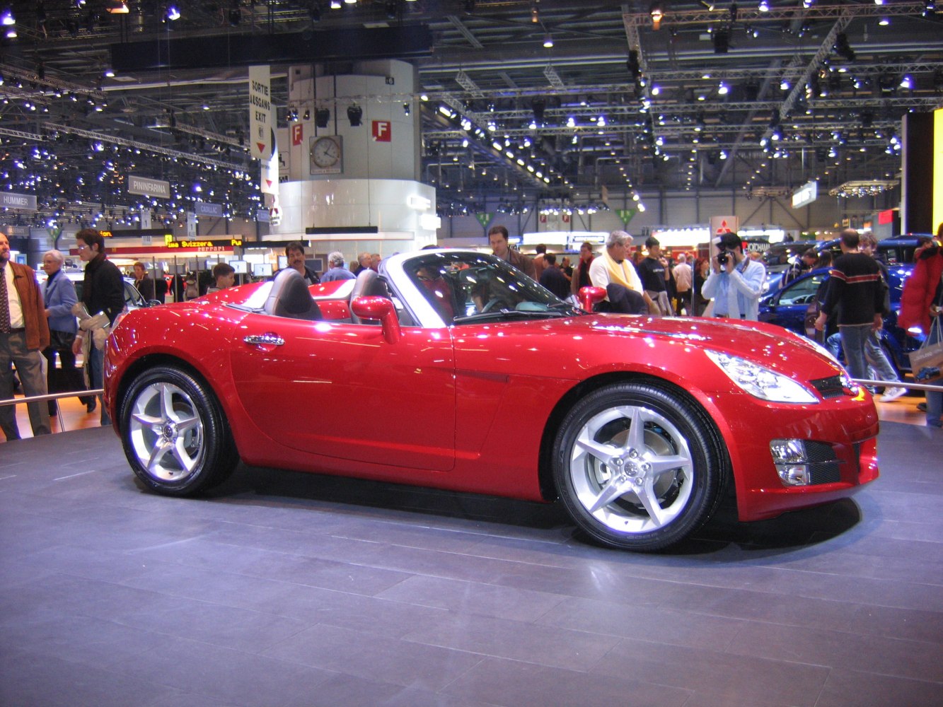Red convertible roadster with sleek design and alloy wheels