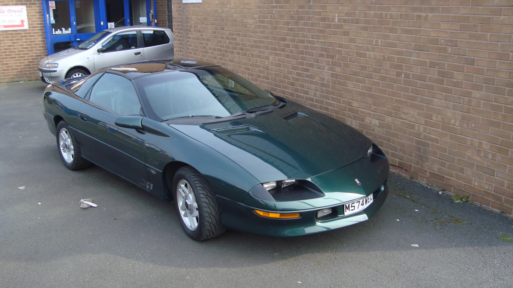 Pop-up headlights and sleek aerodynamic sports coupe design.
