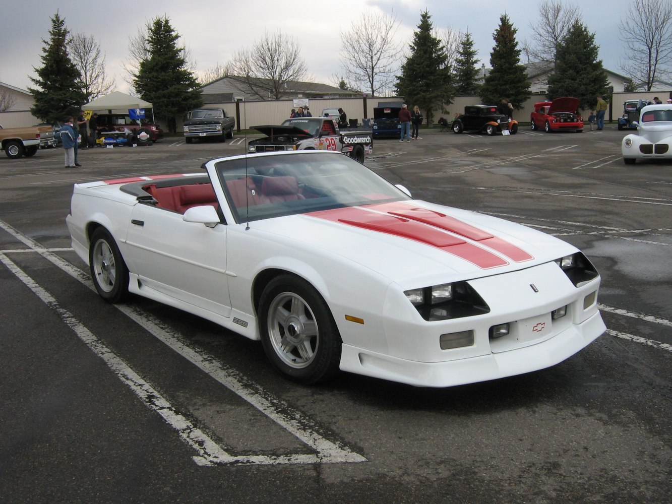 White convertible with red racing stripes and sporty alloy wheels