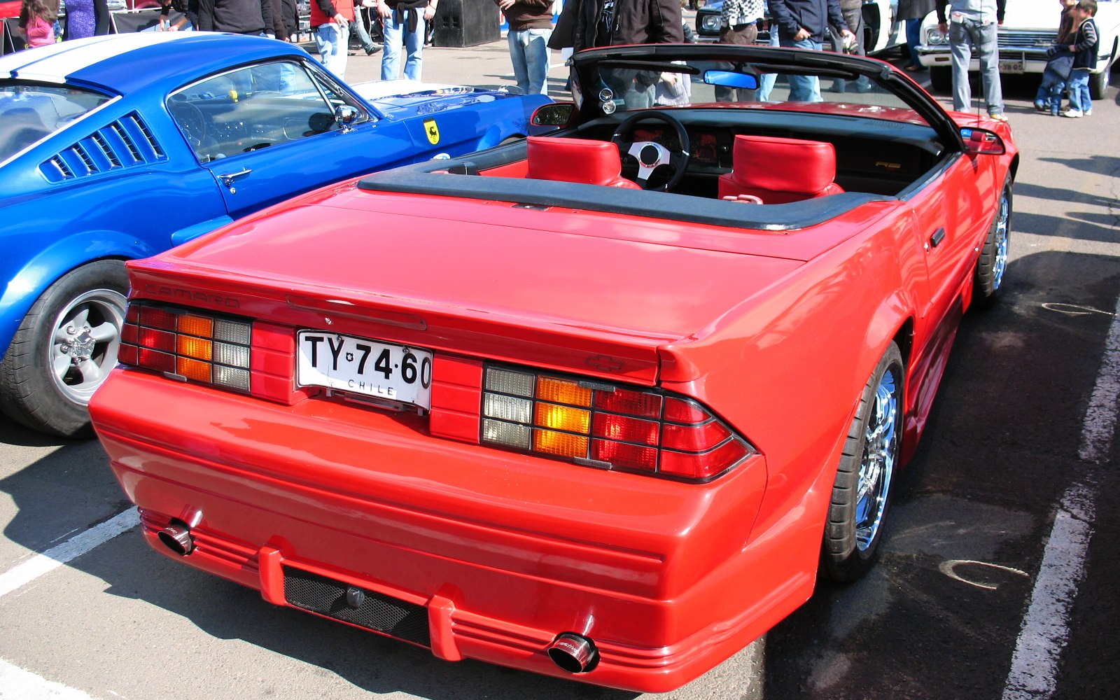Rear view of convertible with taillights and dual exhausts