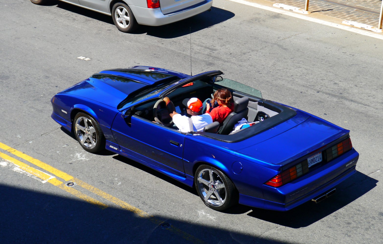 Blue 1991 convertible with sporty alloy wheels and open top