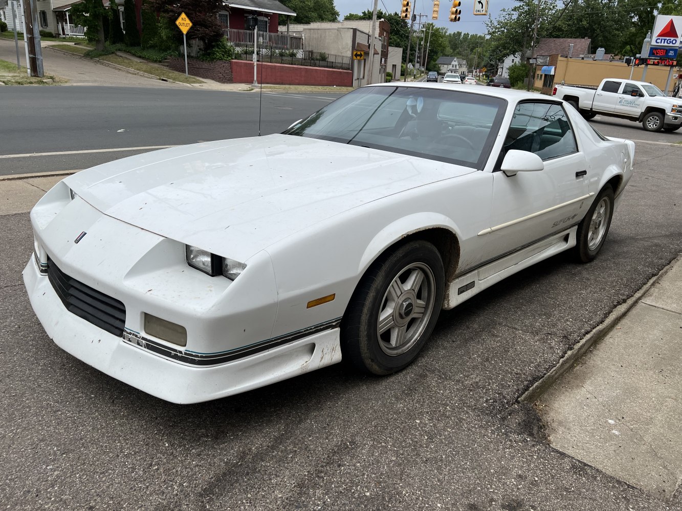 White Camaro III facelift with sharp-edged front and alloy wheels