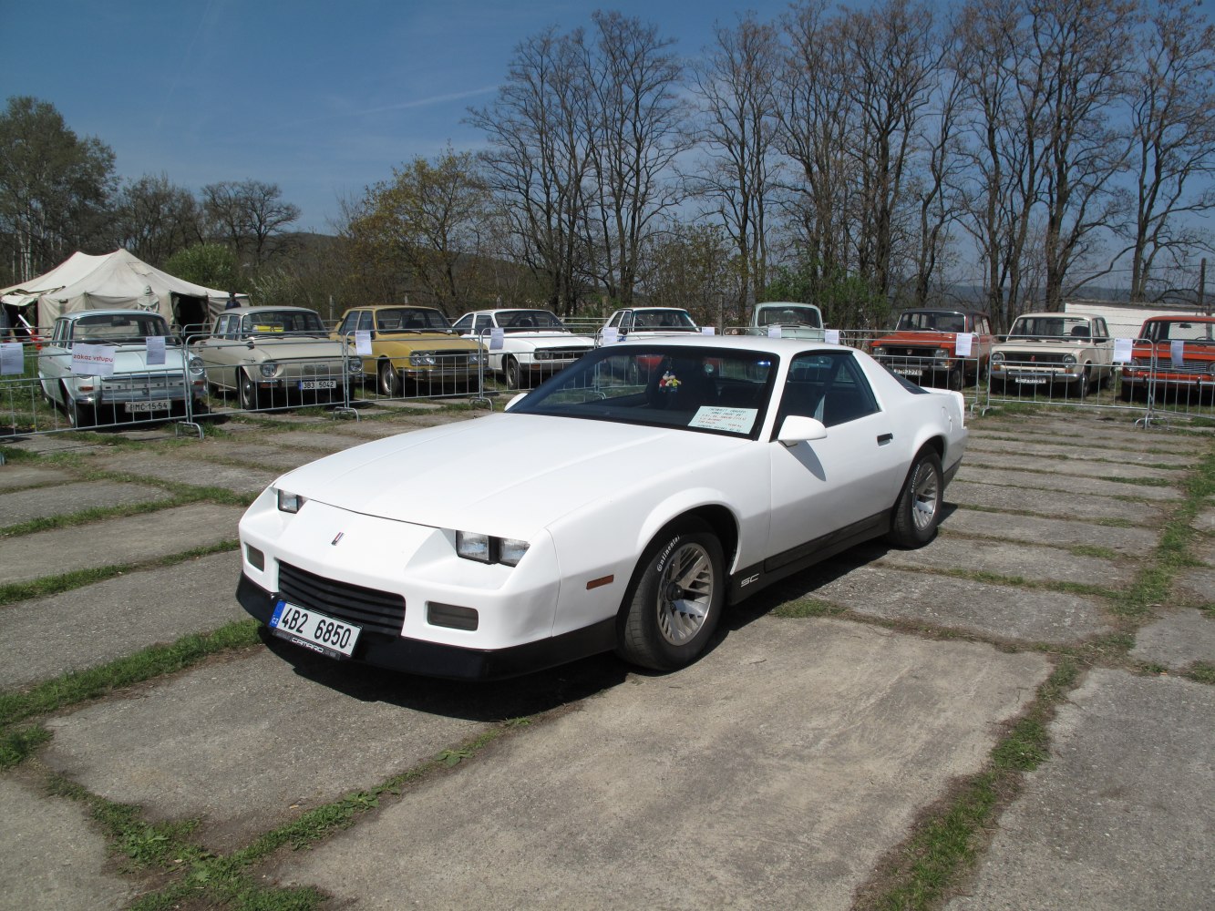 White sports coupe with angular front and pop-up headlights