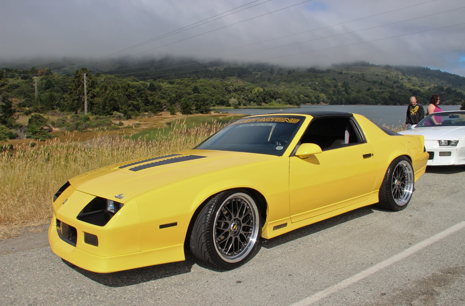 Yellow Camaro III facelift with custom multi-spoke wheels and aggressive front fascia