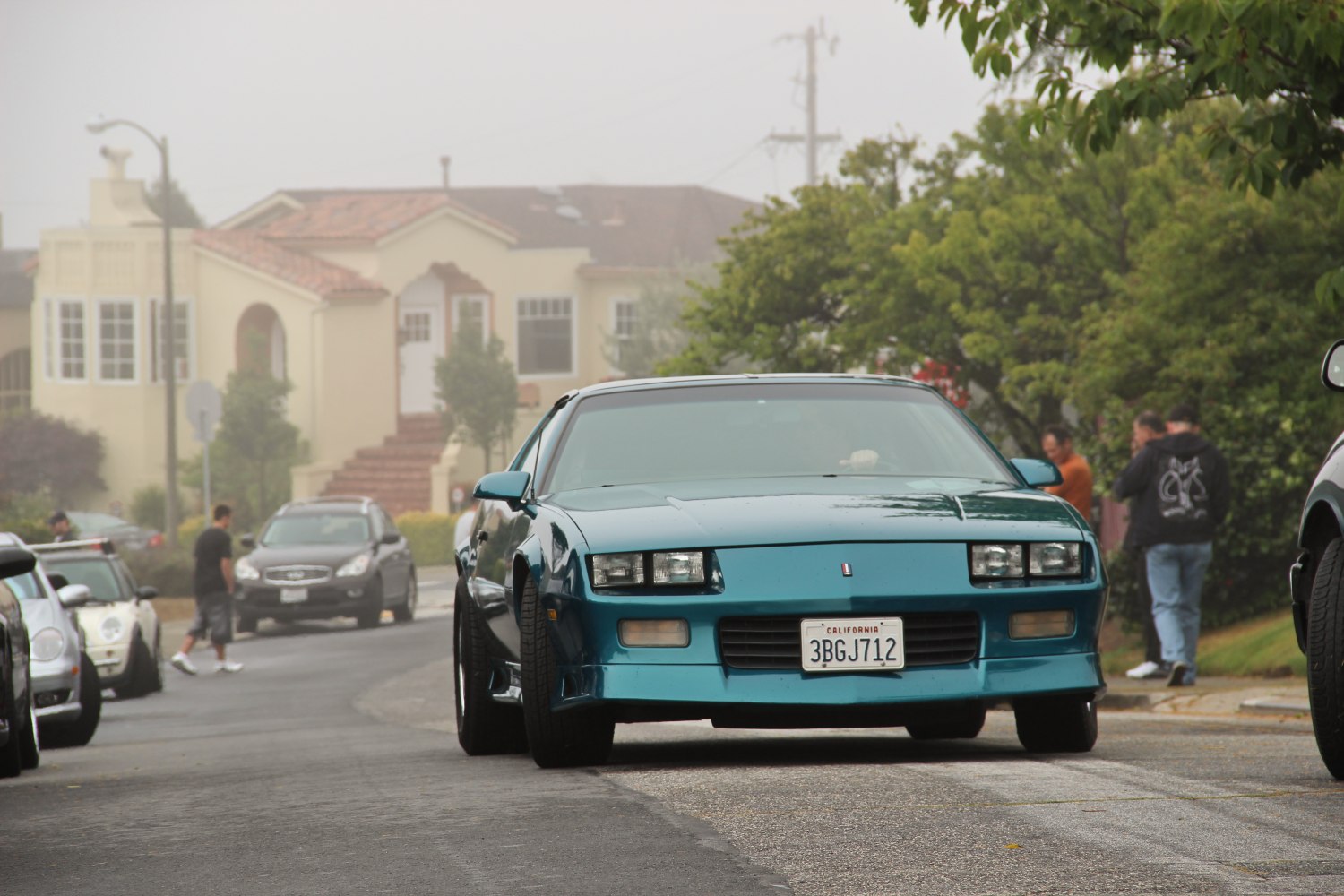 Sporty front with pop-up headlights and wide stance.